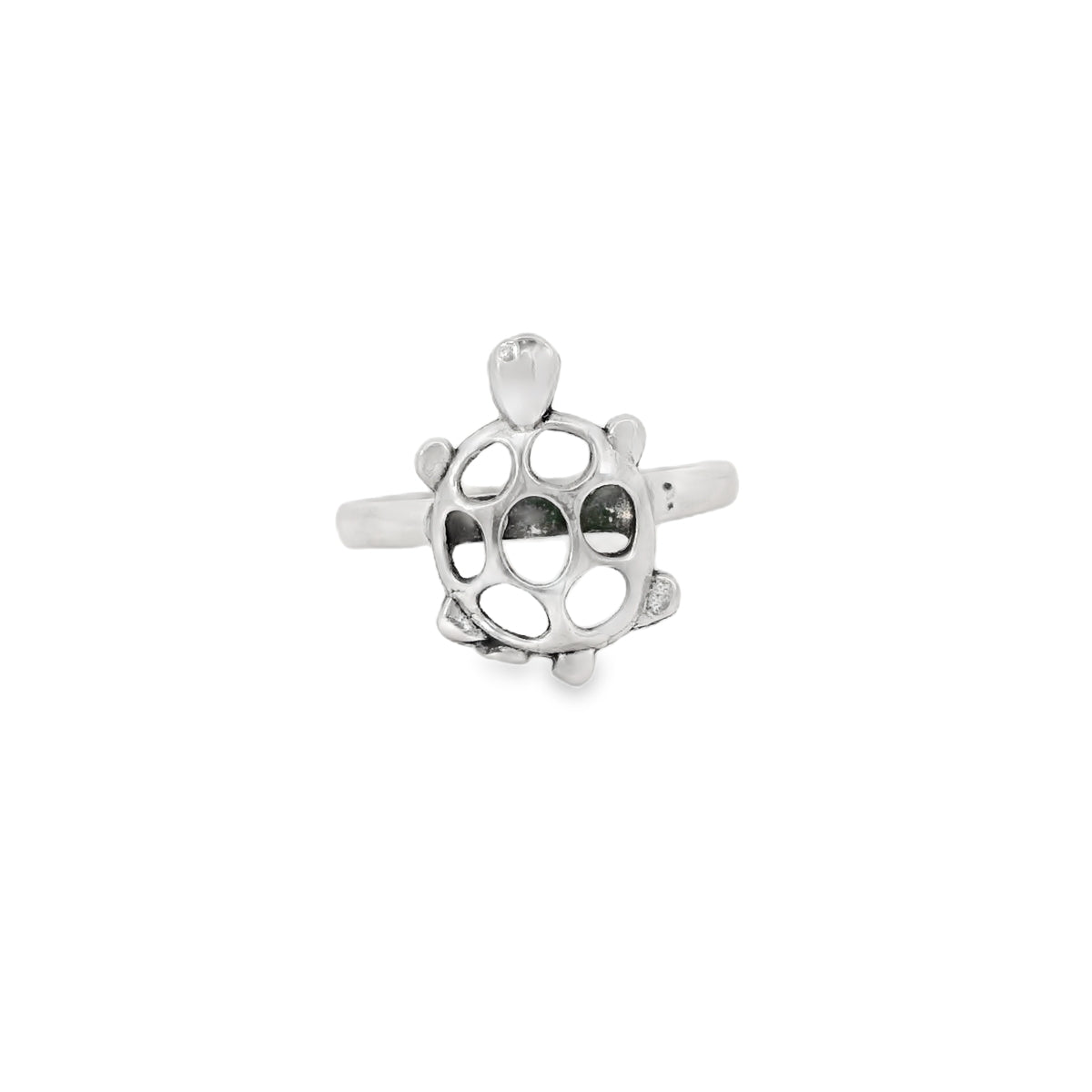 Silver turtle-shaped ring on a white background