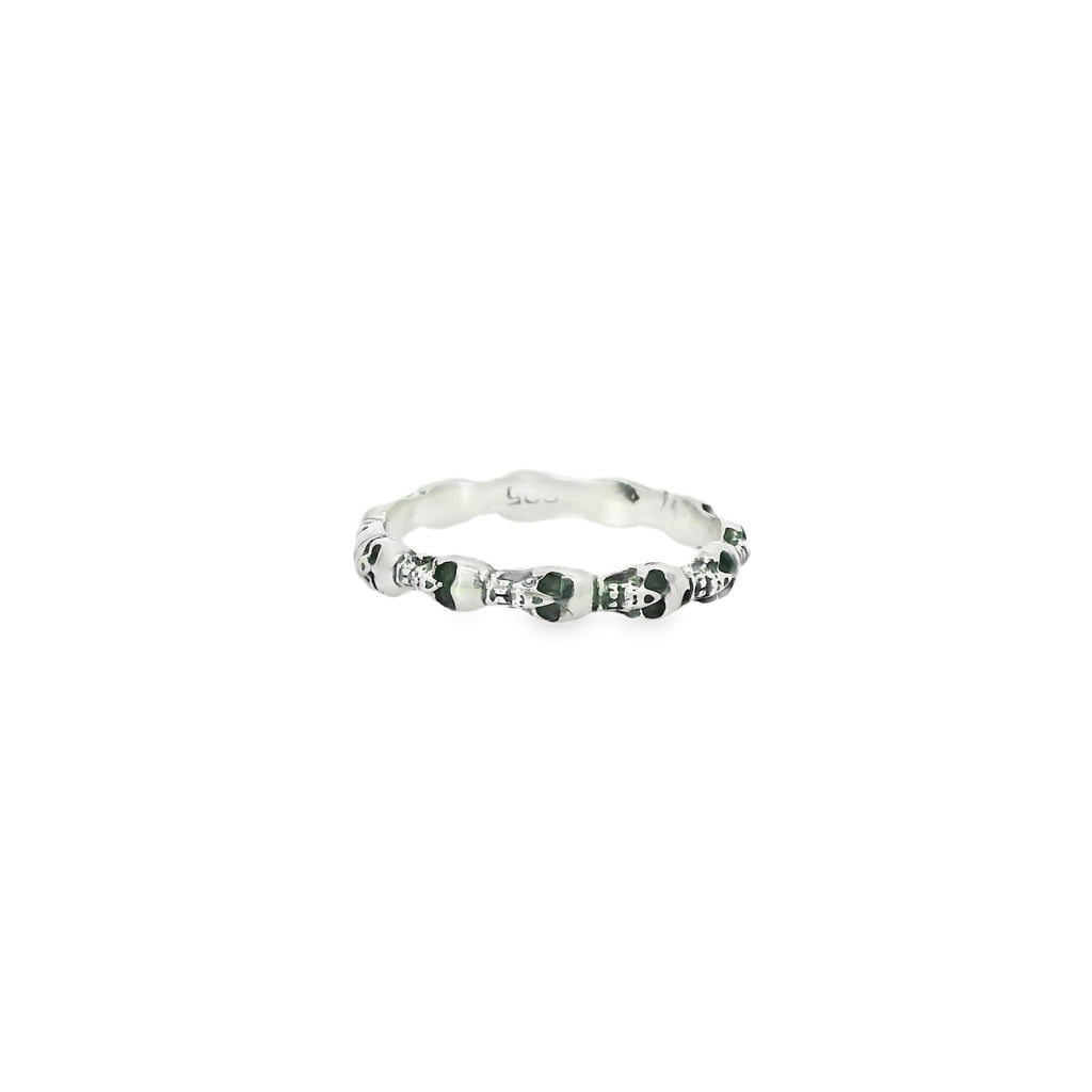 Silver ring with skull on a white background