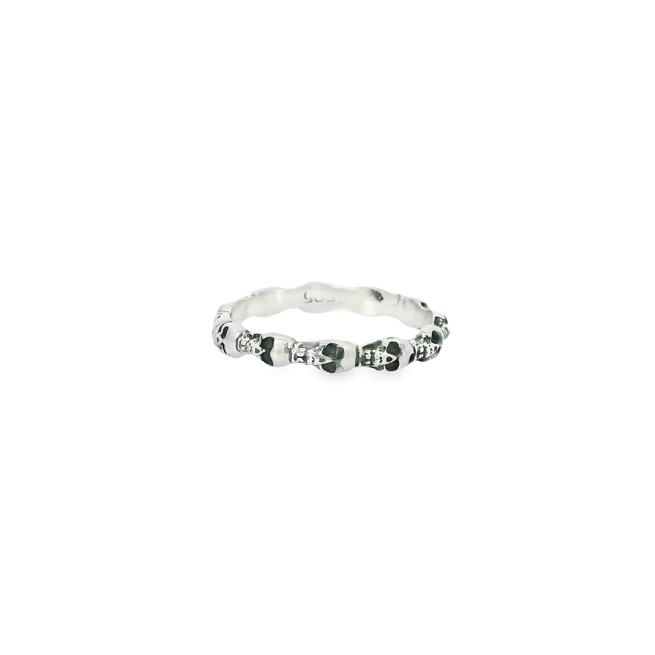 Silver ring with skull on a white background