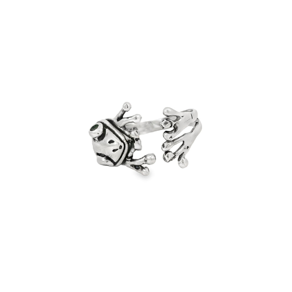 Silver ring with a unique frog design on a white background