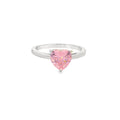 A silver ring featuring a heart-shaped pink gemstone in a prong setting, shown against a plain white background.