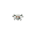 Silver skull and crossbones ring with red eyes on a white background