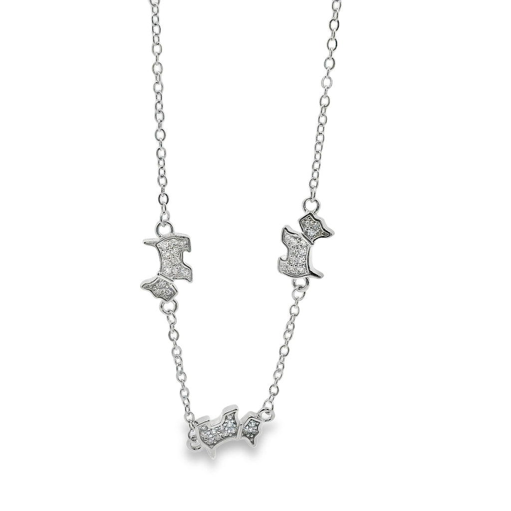 Silver bracelet with dog shaped pendants on a white background