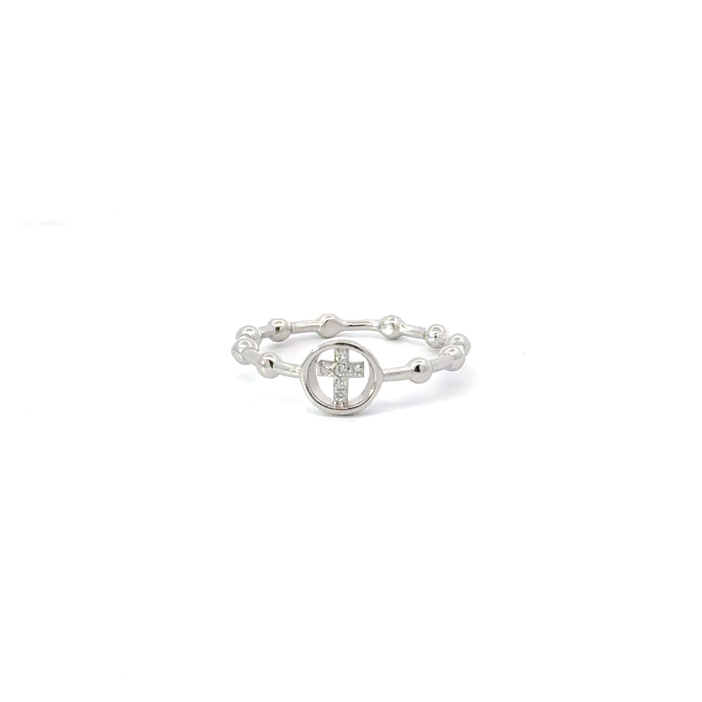 A sterling silver ring with a white cubic zirconia center stone in the shape of a cross, with small silver beads around the band.