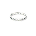 A sterling silver ring with a geometric infinity pattern design