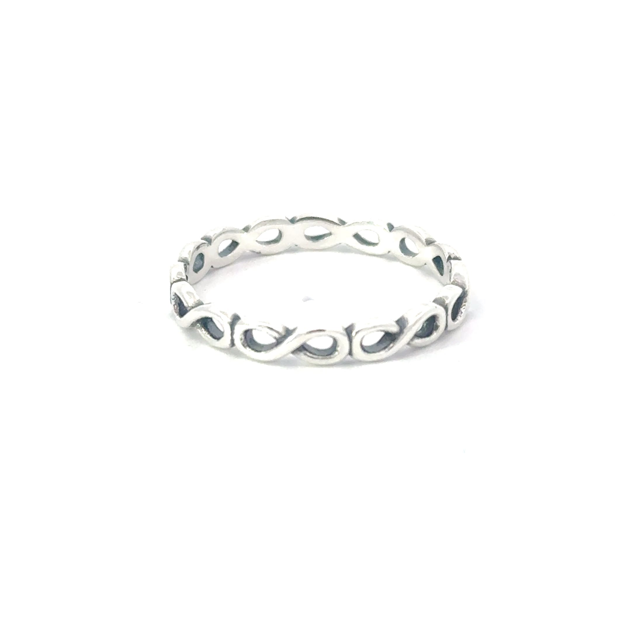 A sterling silver ring with a geometric infinity pattern design
