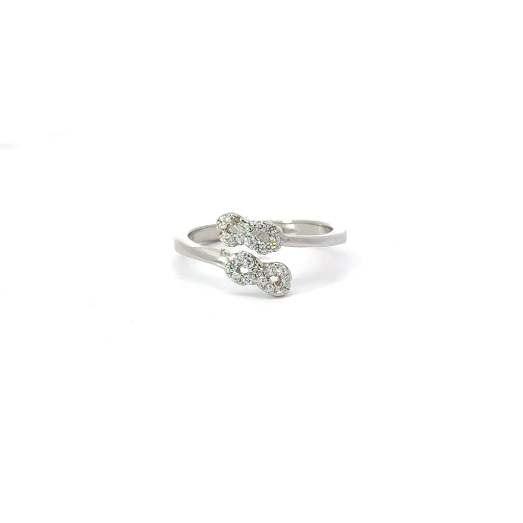 A white cubic zirconia sterling silver ring with an infinity symbol design.