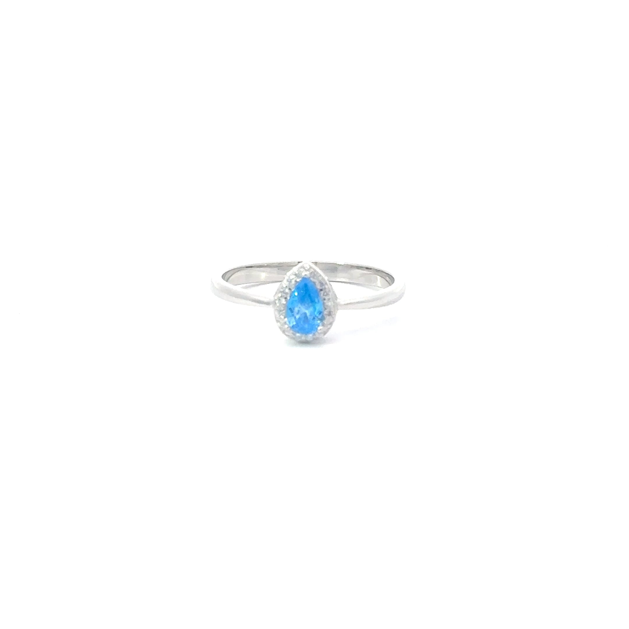 A sterling silver ring with a teardrop-shaped aquamarine cubic zirconia centerpiece, set in a smaller circular frame with smaller clear stones around it.