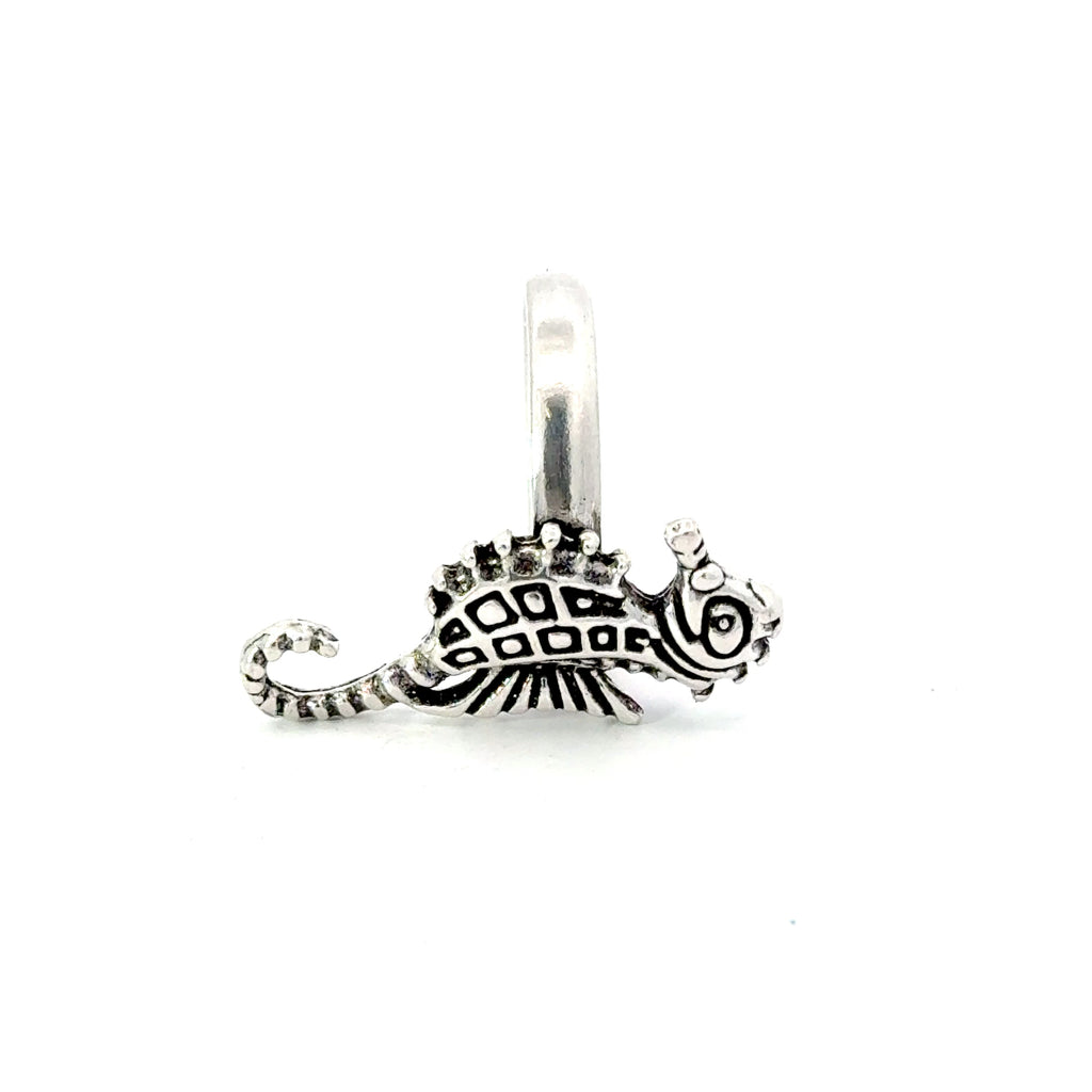 A sterling silver ring featuring a seahorse design with intricate details.