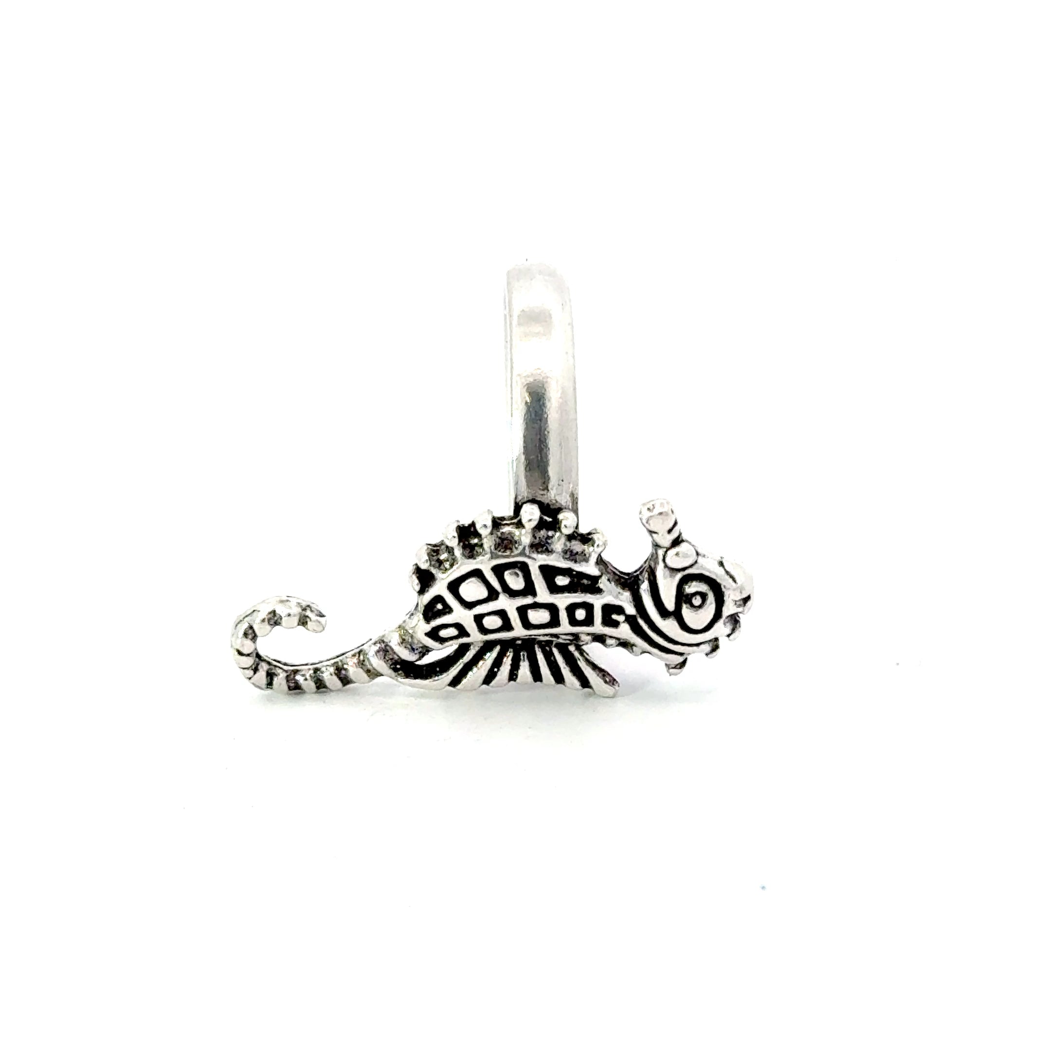 A sterling silver ring featuring a seahorse design with intricate details.