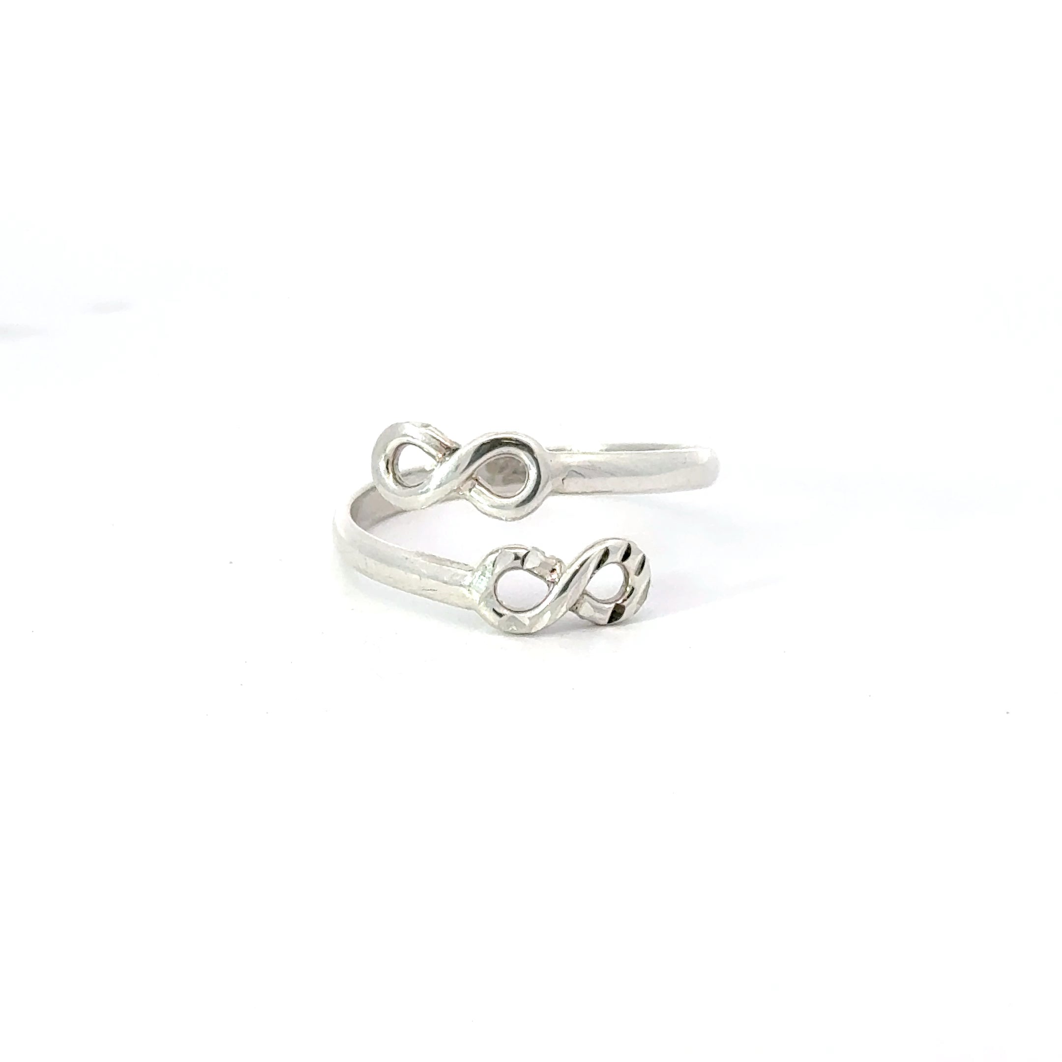 A sterling silver ring with an infinity symbol design, displayed on a white background.