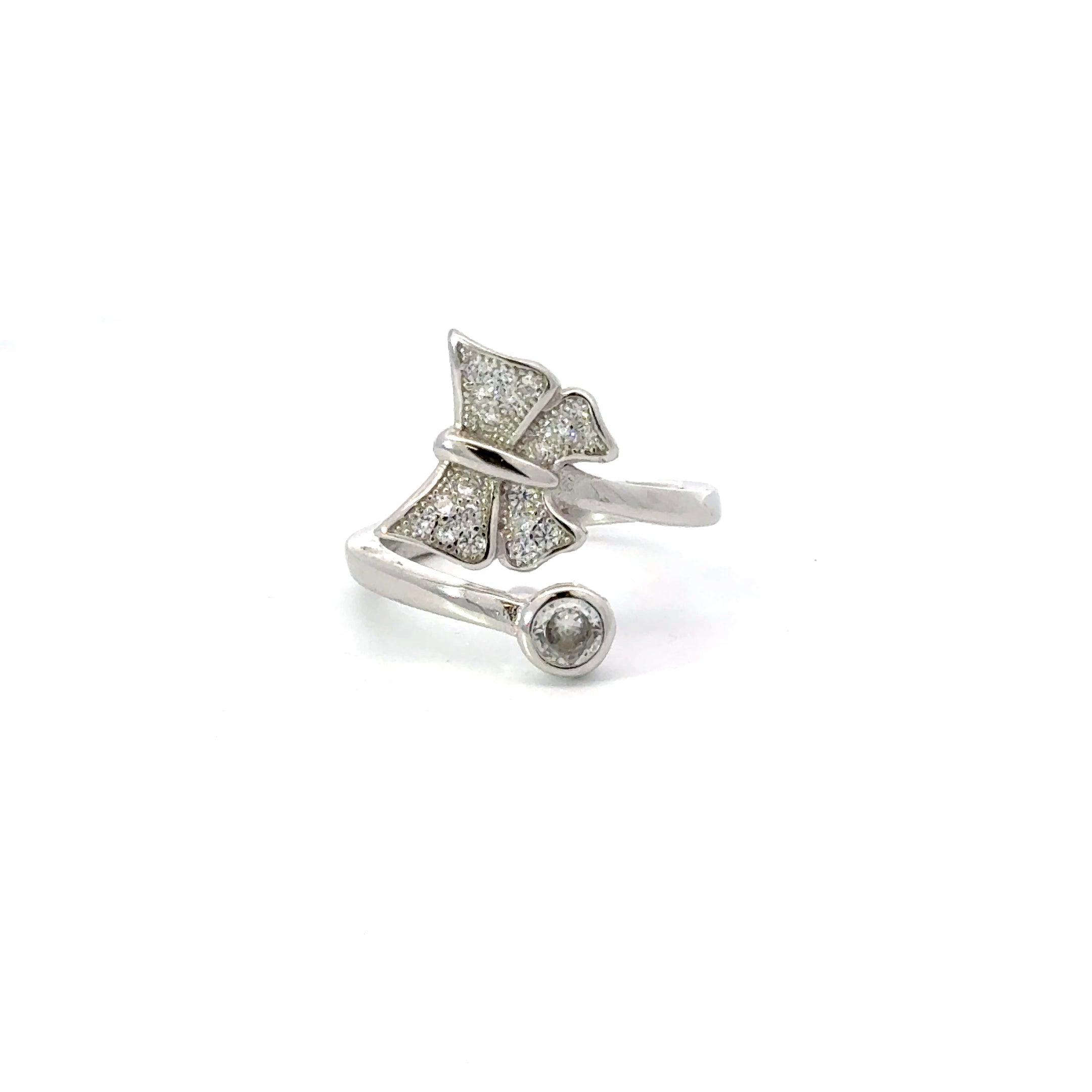A sterling silver ring with a white cubic zirconia butterfly design.
