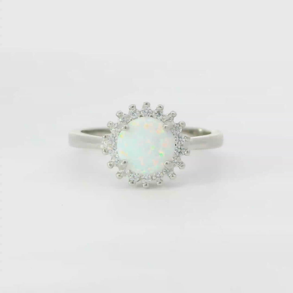 White opal sterling silver ring with cubic zirconia