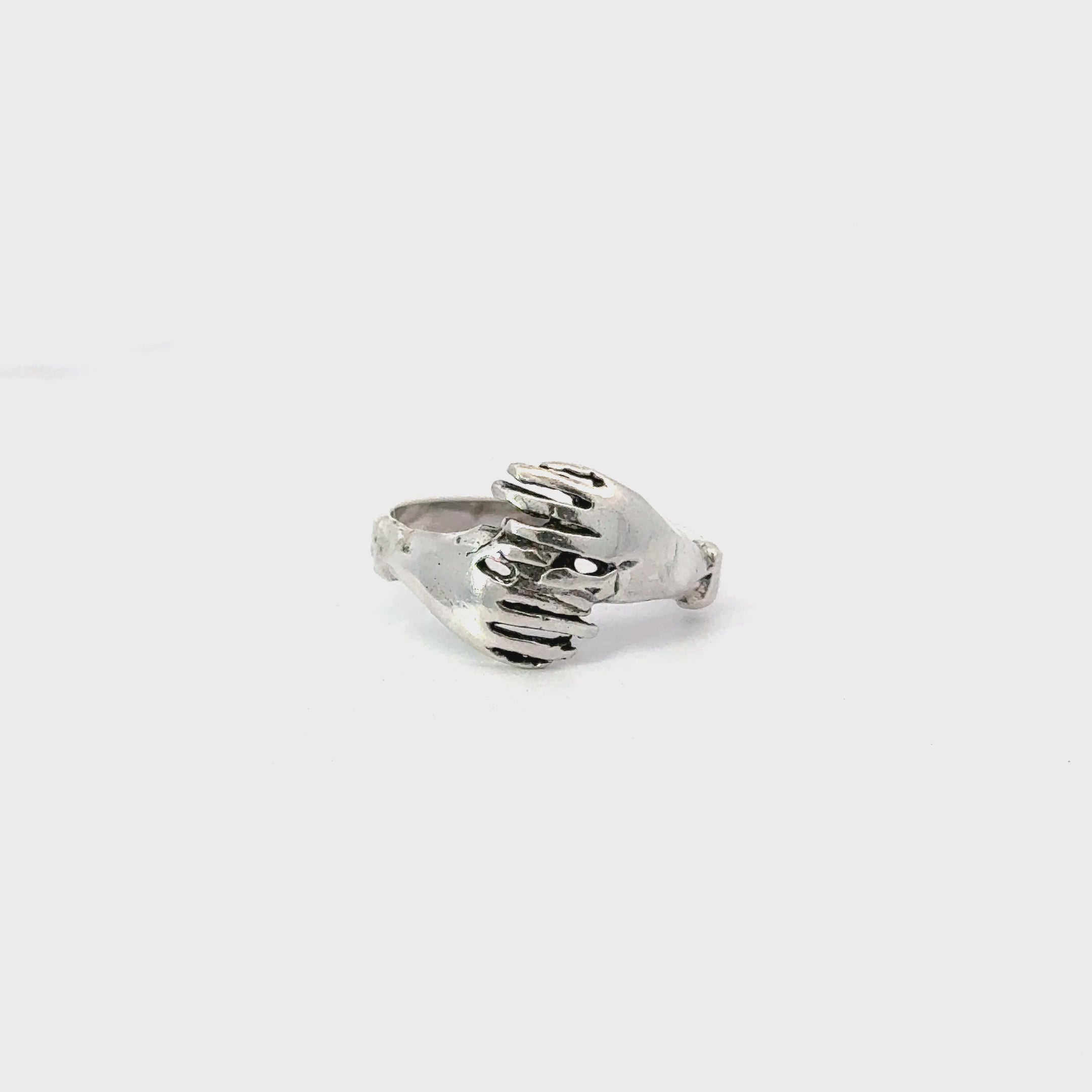 Sterling silver hugging hands ring