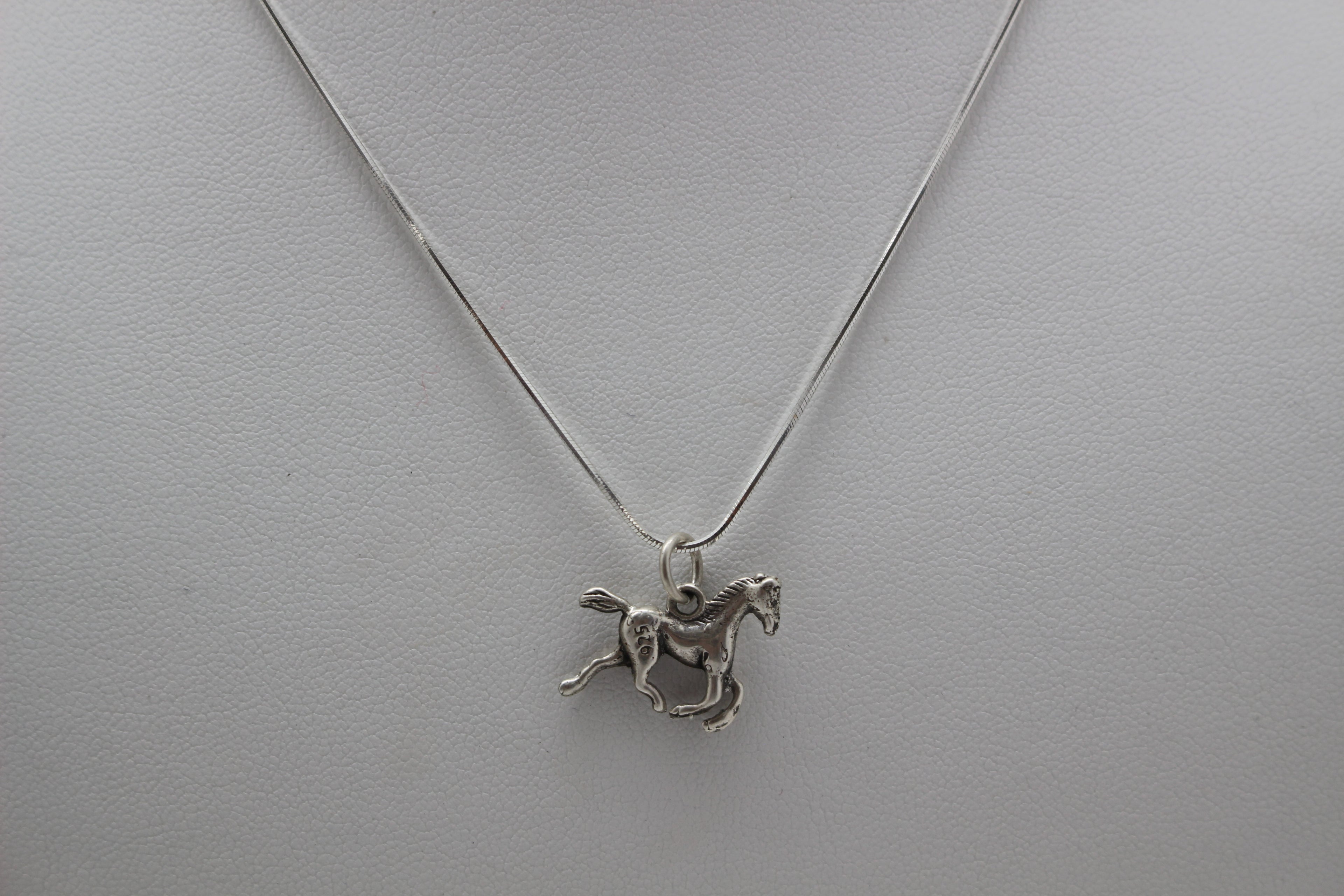 TINY HORSE STERLING SILVER PENDANT